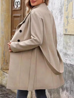 Back view of a beige wool blend coat with belted waist and button details