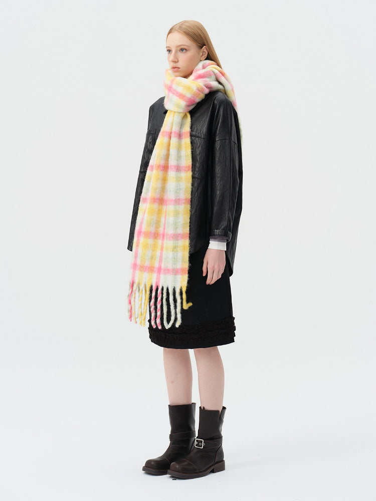woman wearing pink and yellow plaid oversized wool blend scarf