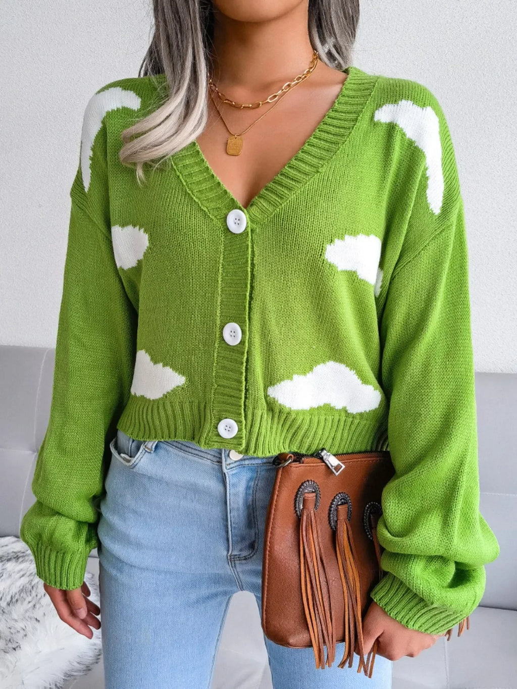 Woman wearing green cloud print cropped cardigan