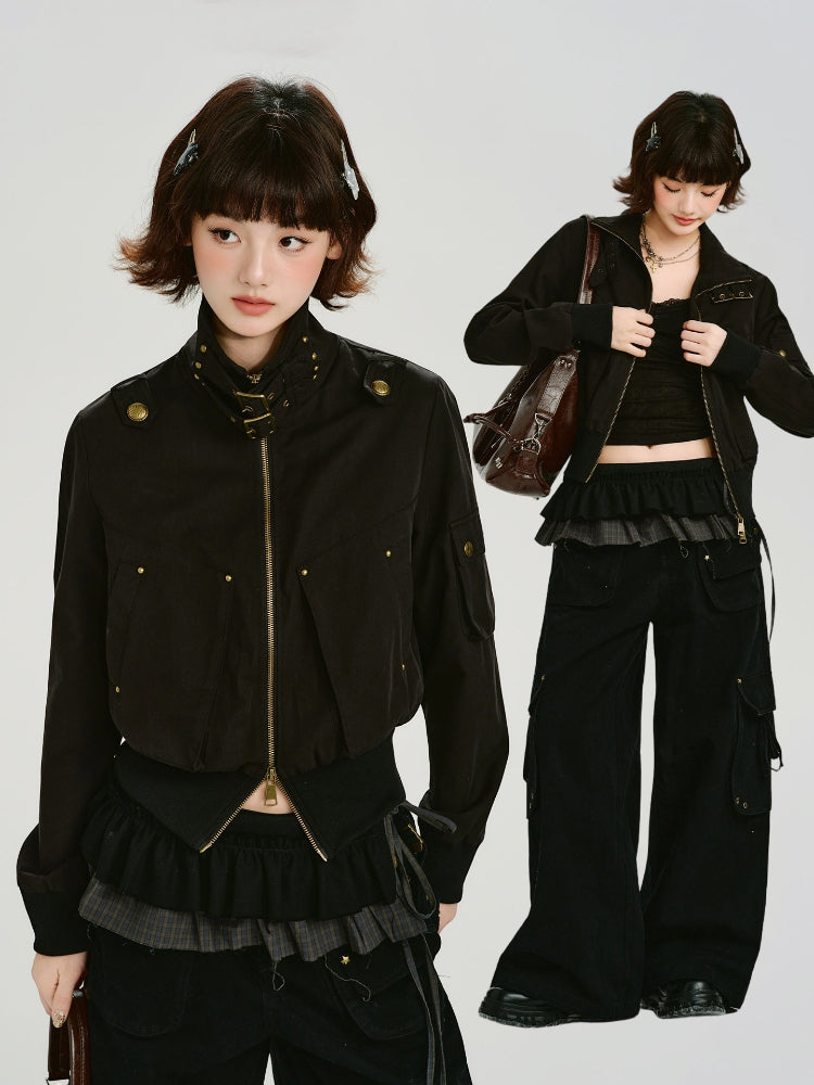 Model showcasing black bomber jacket with layered skirt and wide-leg pants