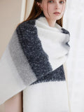 Detail shot of a winter scarf with prominent horizontal stripes and soft texture