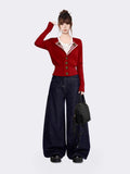 Side view of woman in red knit cardigan with tailored fit and ribbed details