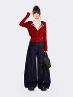 Side view of woman in red knit cardigan with tailored fit and ribbed details