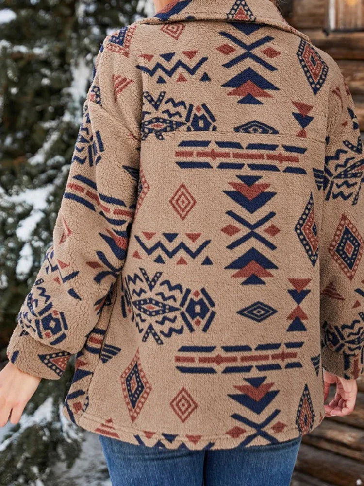 Back view of a woman wearing a brown fleece jacket with a geometric print.