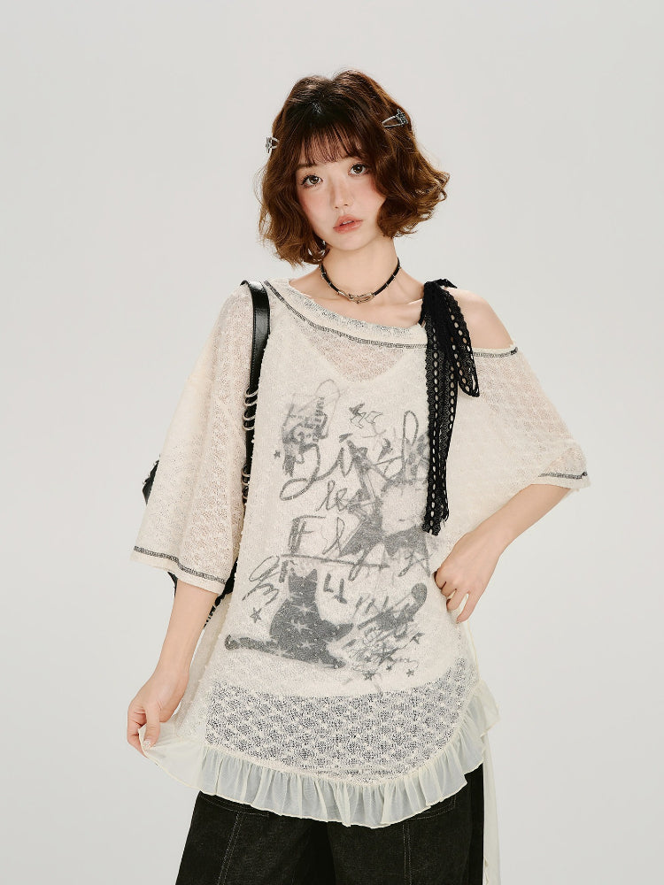 Full body shot of the model in the cream lace tunic and black pants.