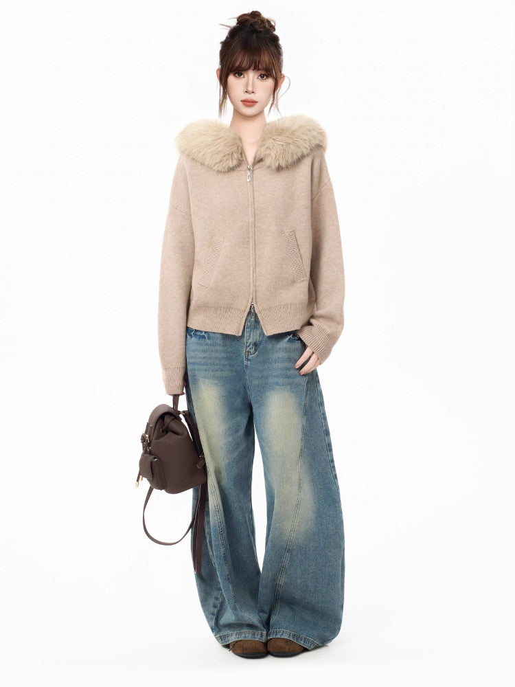 Model posing with a faux fur collar knit cardigan, showing front pockets