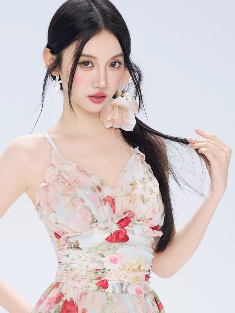 Close-up of the v-neckline and ruffle detail on a floral print dress.