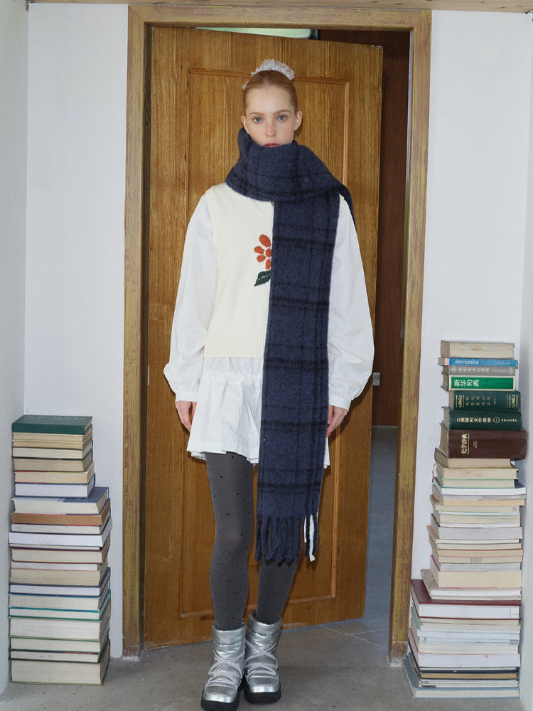 detailed view of a textured wool blend tartan scarf