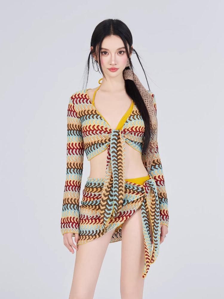 Woman wearing a colorful crochet knit tie-front crop top and matching wrap skirt