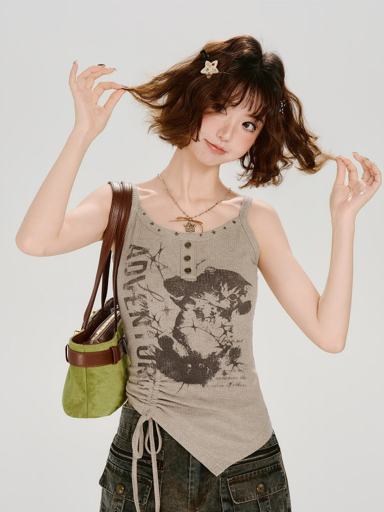 Woman wearing a taupe ribbed knit tank top with a graphic print and ruched side detail
