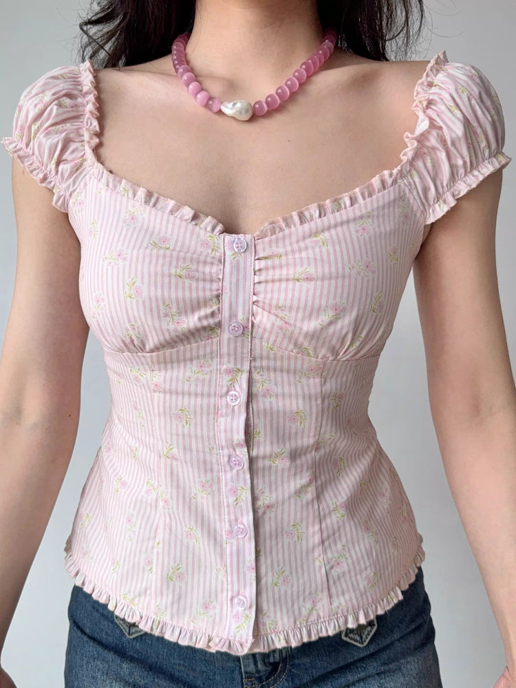 Front view of a pink striped floral print top with gathered fabric at the bust and button details.