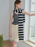 Full body shot of a model in a striped scarf