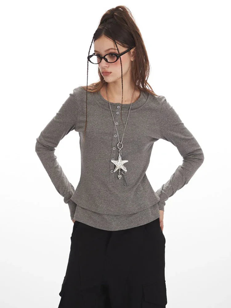 Close-up of the grey faux layered henley top with layered neckline detail