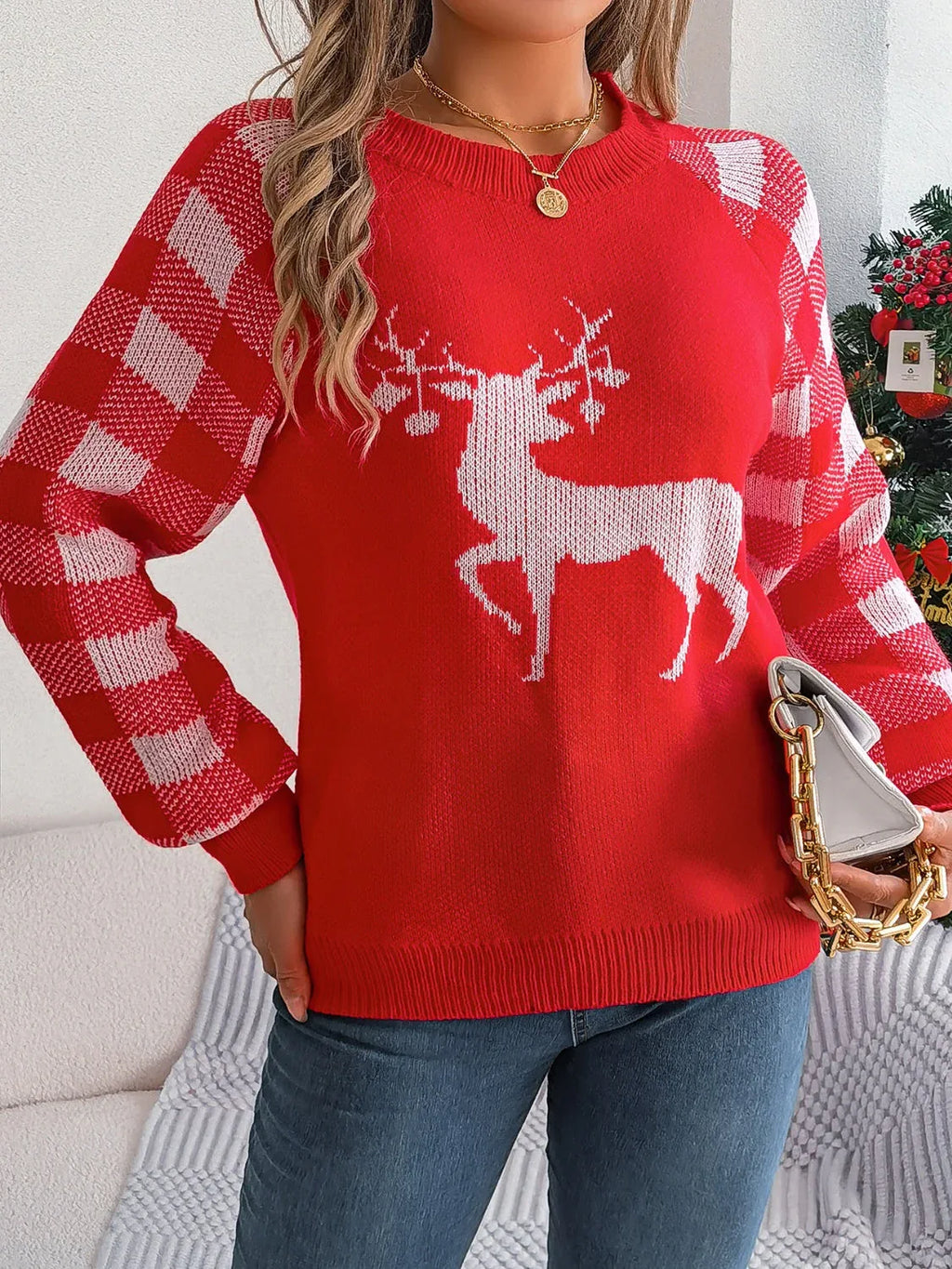 Woman wearing a white and red festive reindeer knit sweater with buffalo plaid raglan sleeves. - View 6 | WEUXS