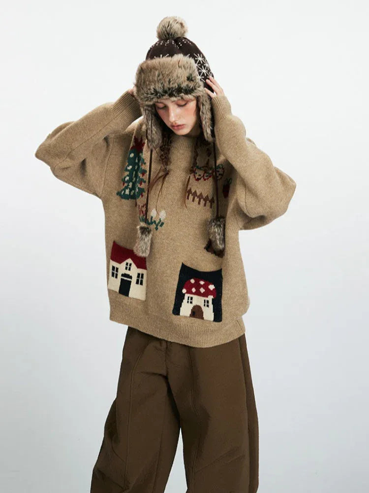 Close-up of a woman adjusting her winter hat while wearing a tan knit sweater
