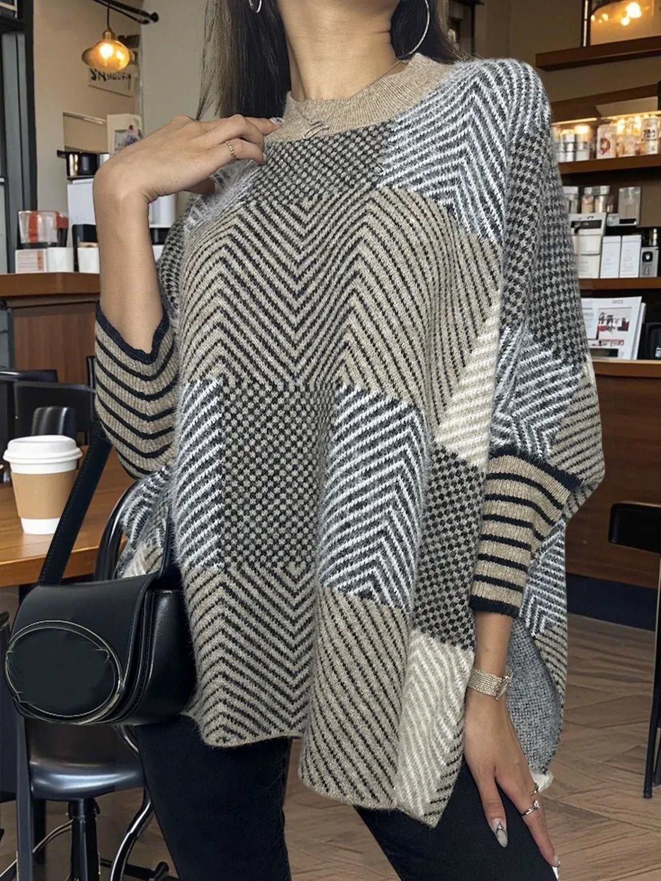 Back view of a woman in a geometric print knit poncho