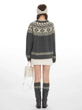 Back view of a woman in a grey Fair Isle crewneck sweater