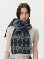 Woman wearing a gray and black argyle knit scarf