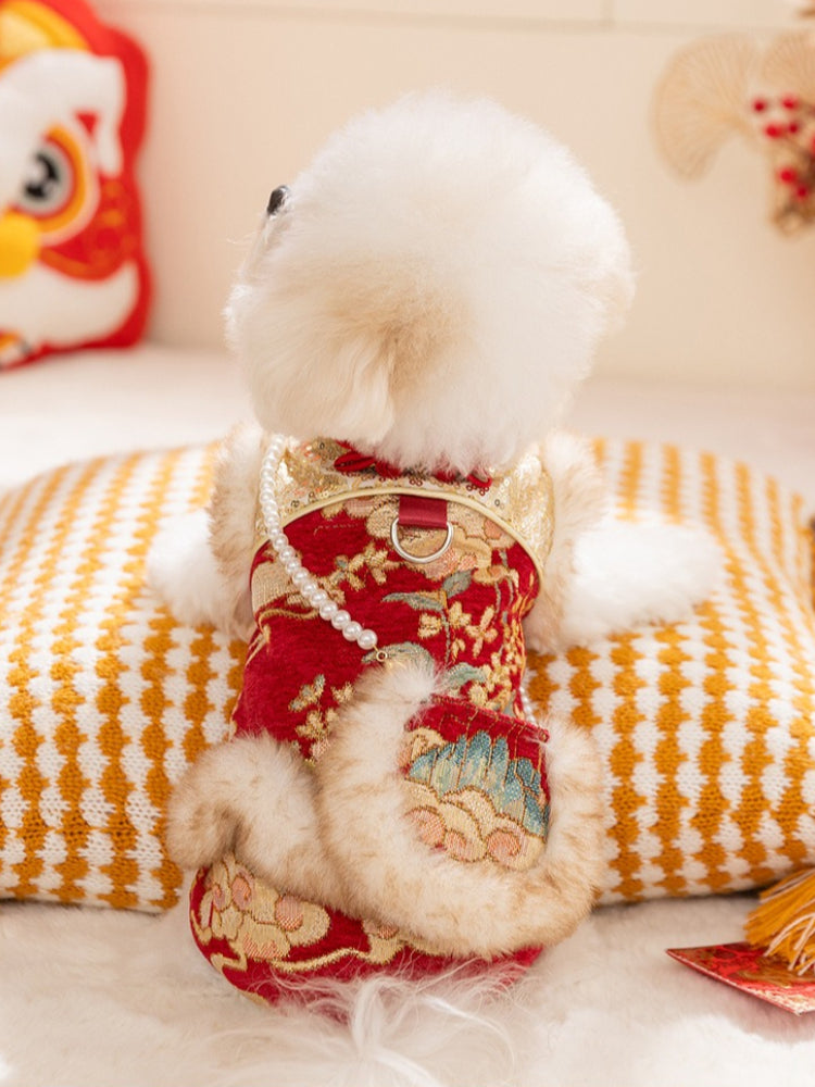 Rear view of a white dog wearing a decorative pet vest with a faux fur pocket.