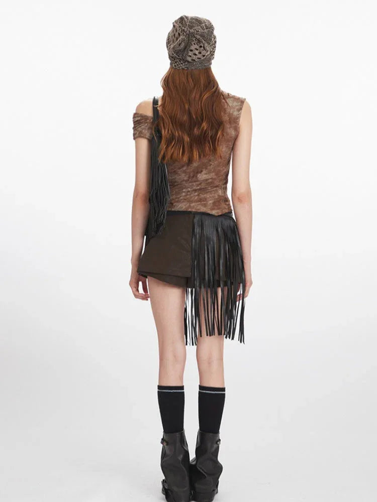Back view of a model in a brown textured knit top with an asymmetrical neckline and draping.