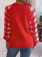 Woman wearing a white and red festive reindeer knit sweater with buffalo plaid raglan sleeves. - View 10 | WEUXS