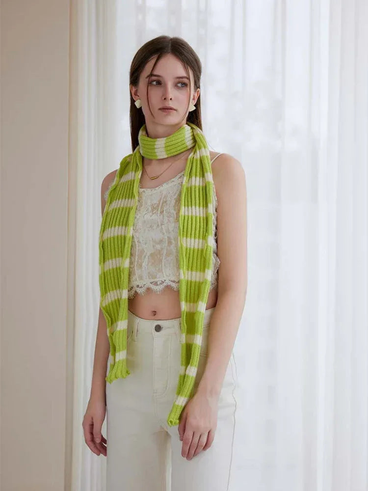 Woman wearing a long black and white striped knit scarf with ruffle edges - View 7 | WEUXS