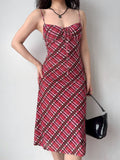 front view of a red and pink plaid mesh midi dress with spaghetti straps