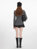 Back view of model in heathered gray long sleeve top