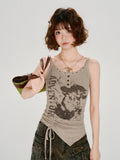 Close-up of a woman wearing a taupe ribbed knit tank top with graphic print and side ruching