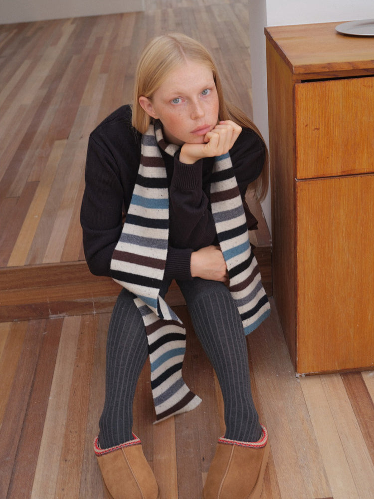 Casual outfit featuring striped knitted scarf and knee-high socks