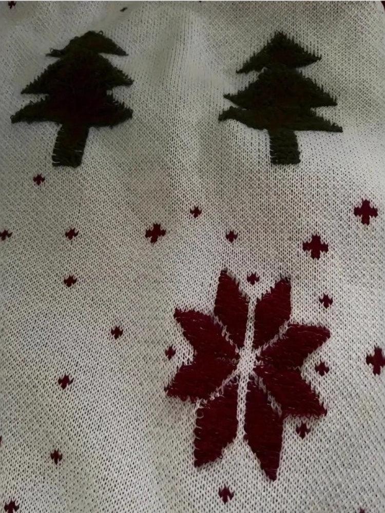 Detail of the scalloped hem on a festive knit pullover.