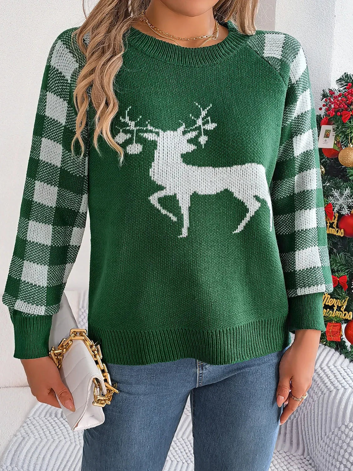 Woman wearing a white and red festive reindeer knit sweater with buffalo plaid raglan sleeves. - View 14 | WEUXS