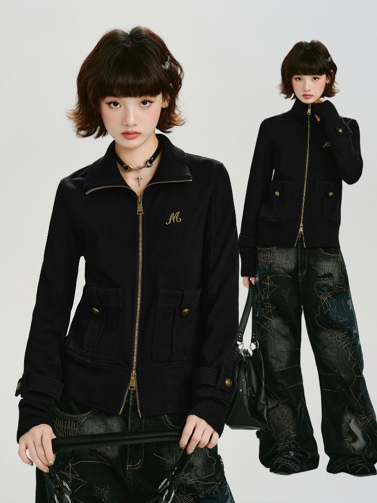 Back view of the black knit jacket with ribbed cuffs.