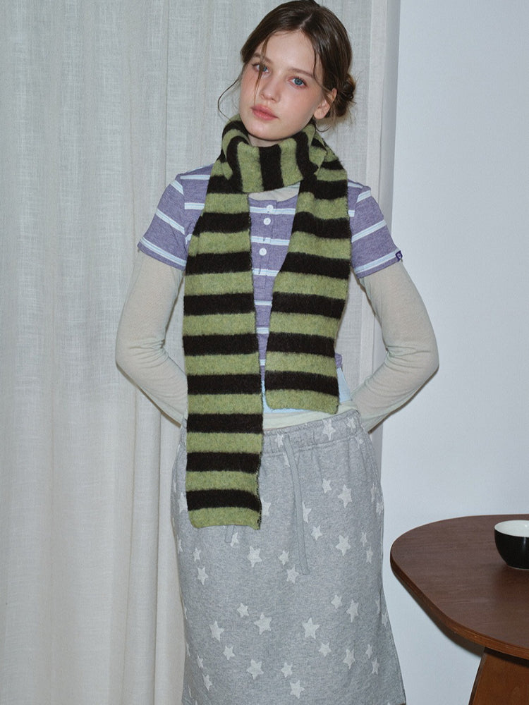 Close-up of a person wearing a striped scarf