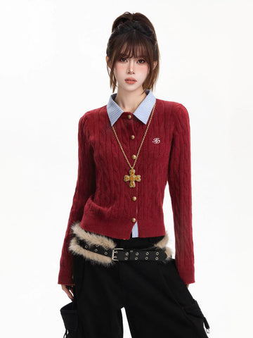 Woman wearing a red cable knit cardigan with a blue collared shirt underneath and a gold cross necklace.