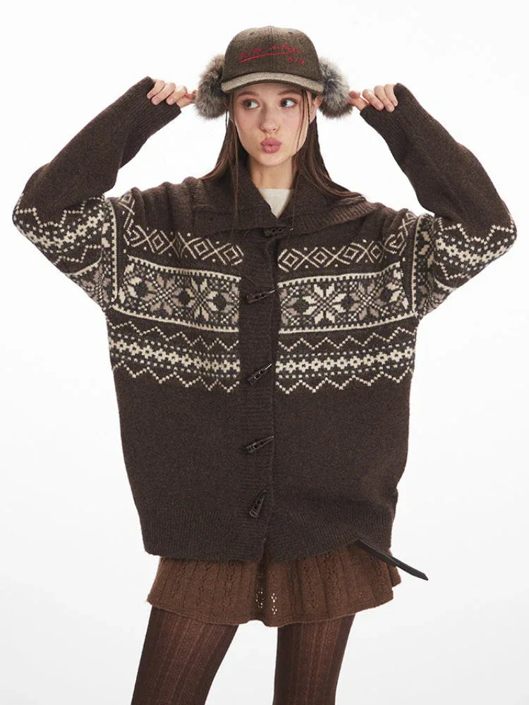 Woman posing in a brown Fair Isle knit cardigan.