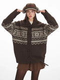 Woman posing in a brown Fair Isle knit cardigan.