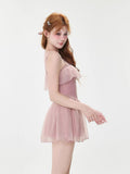 Side view of the model showcasing the ruffled dress silhouette