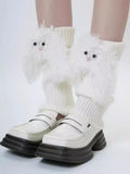 Close-up of white fuzzy character leg warmers worn with shoes