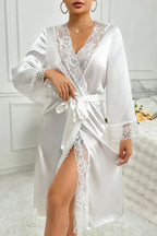 Back view of a woman in a white satin robe