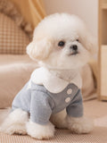 Light blue knit pet sweater with a white Peter Pan collar and two decorative white buttons on the front
