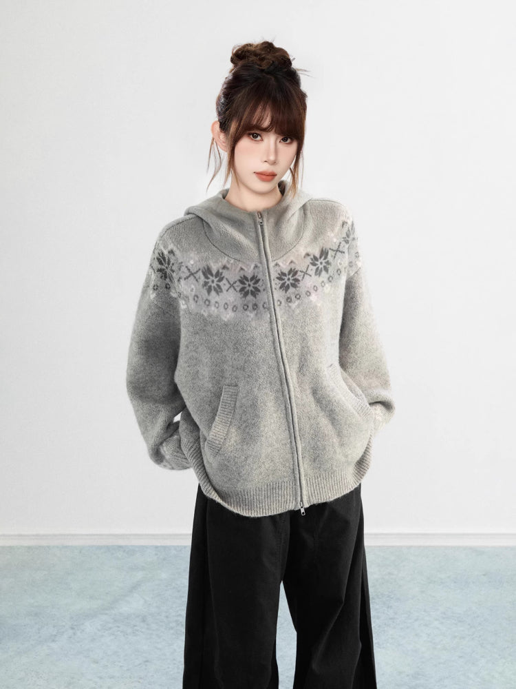Side view of a woman wearing a black Fair Isle knit hoodie with front pockets