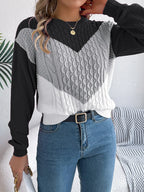 Back view of a woman in a casual knit sweater.