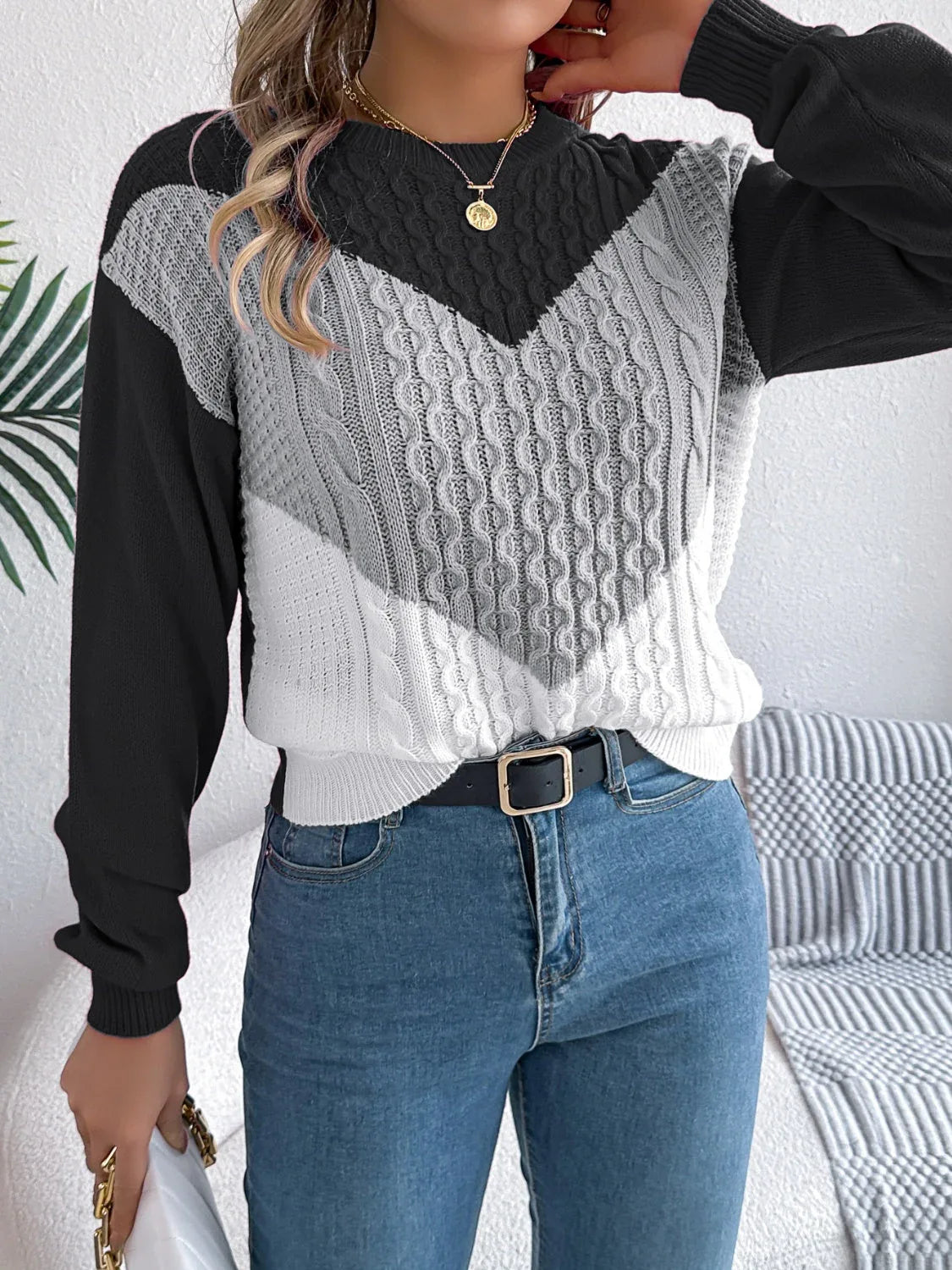 Back view of a woman in a casual knit sweater.