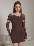 Woman wearing a brown ruched mesh bodycon dress with an asymmetrical neckline and long sleeves with cut-outs.