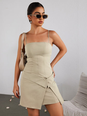Woman wearing a beige sheath dress with spaghetti straps and an asymmetrical hem