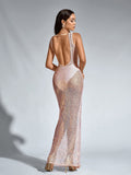 Rear view of a woman in a floor-length, sequined mesh gown with a deep scoop back.