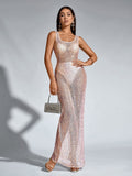 Model presenting a glamorous, floor-length sequined gown with a translucent effect.