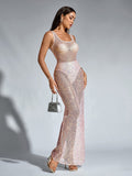 Full body shot of a woman in a shimmering, floor-length sequined gown.