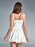Back view of white square neck dress with balloon hem
